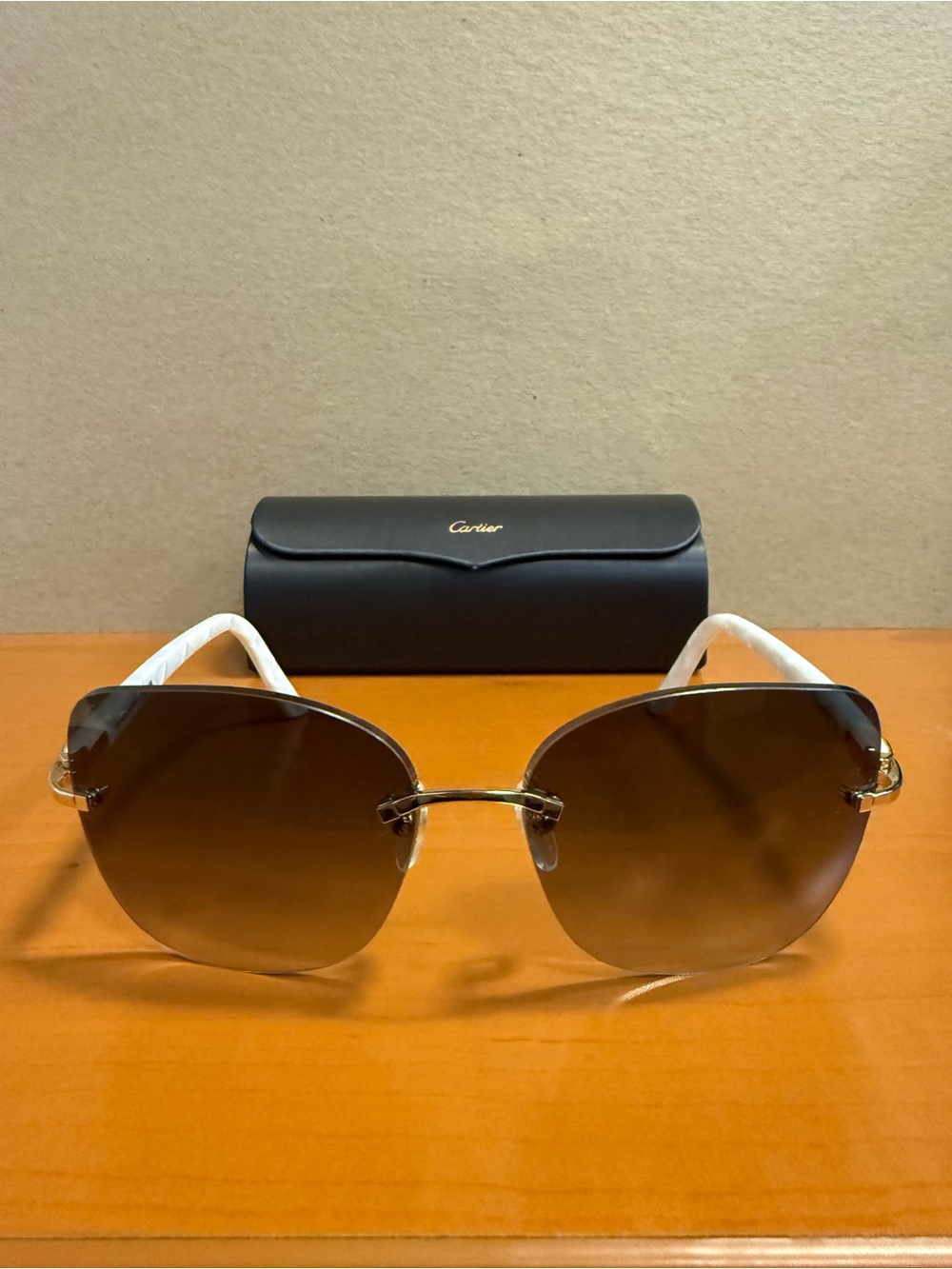 Cartier Women's Rimless Sunglasses with Brown Gradient Lenses and White Temples